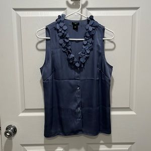 Cute sleeveless blouse with ruffle neckline!